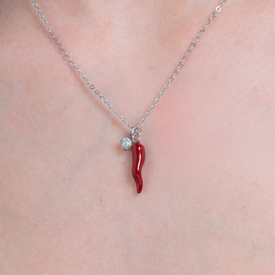 COLLANA IN ACCIAIO CON CORNO ROSSO E PUNTO LUCE