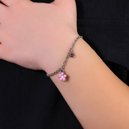 BLUMENARMBAND AUS STAHL MIT ROSA UND WEISSER EMAILLE UND KRISTALL